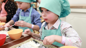 a 4 year old Australian kid learning how to make sushi